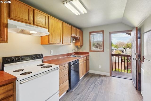 4314 SE 72nd Ave, Portland, OR 97206 - kitchen with electric range, under cabinet range hood, dishwasher, vaulted ceiling, and a sink