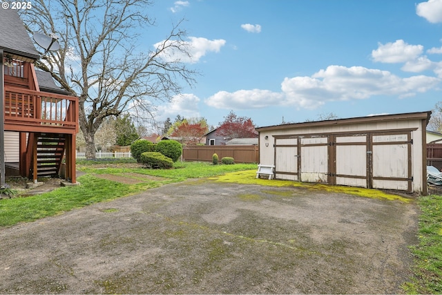4314 SE 72nd Ave, Portland, OR 97206 - view of yard with a deck, stairs, an outdoor structure, and a garage