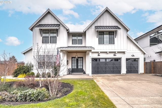 modern inspired farmhouse with a garage