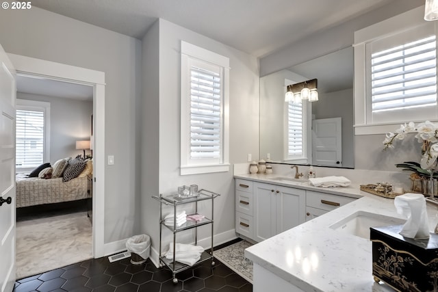 bathroom featuring a healthy amount of sunlight and vanity