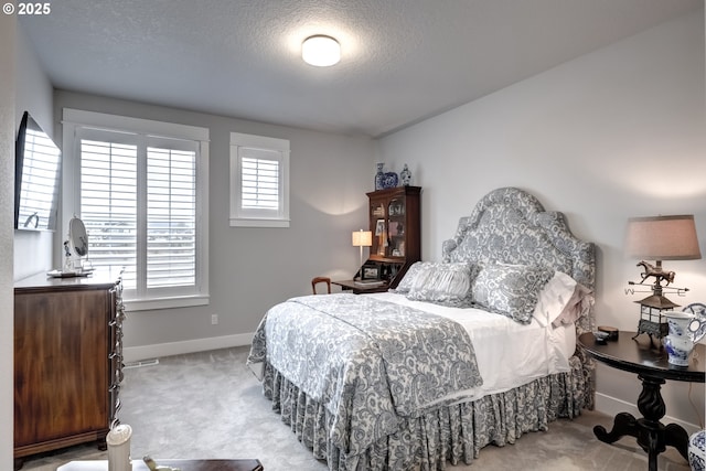 carpeted bedroom with a textured ceiling