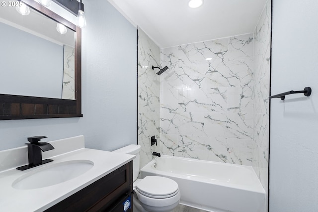 full bathroom featuring toilet, vanity, and tiled shower / bath