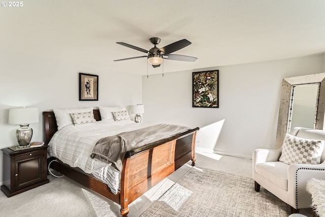 bedroom featuring light carpet and ceiling fan