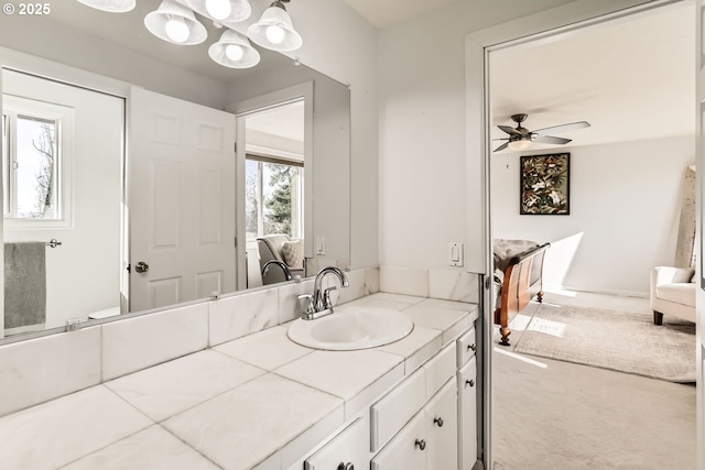 bathroom featuring ceiling fan and vanity