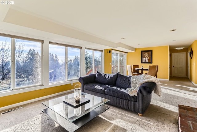 living room featuring a wealth of natural light