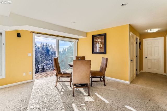 dining space with light carpet