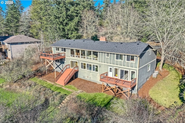 rear view of property with a wooden deck