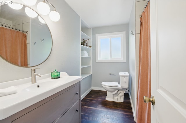 10410 SE 55th Ave, Milwaukie, OR 97222 - full bathroom featuring toilet, wood finished floors, vanity, and baseboards