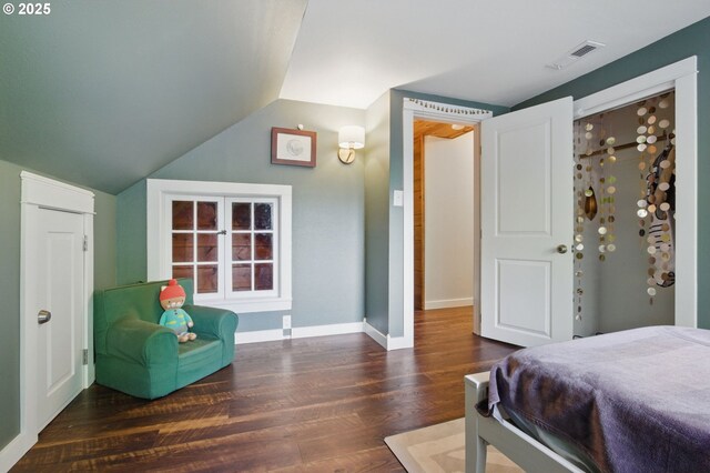 10410 SE 55th Ave, Milwaukie, OR 97222 - bedroom featuring wood finished floors, lofted ceiling, and baseboards