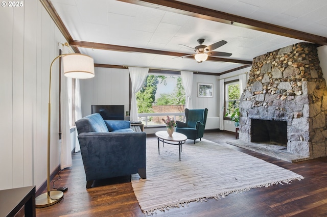 10410 SE 55th Ave, Milwaukie, OR 97222 - living area with wood finished floors, ceiling fan, beam ceiling, and a fireplace