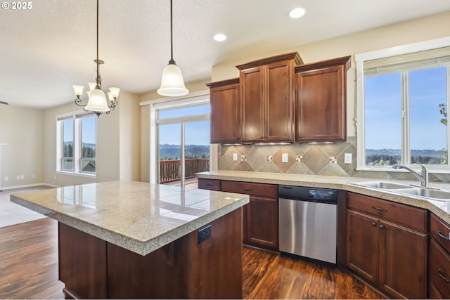 kitchen featuring a sink, dishwasher, tile countertops, tasteful backsplash, and dark wood-style floors