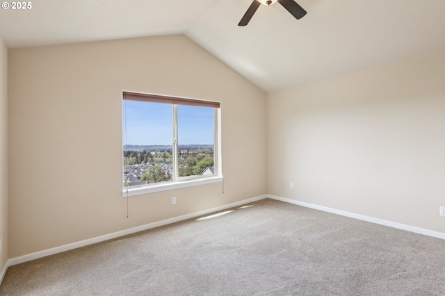 unfurnished room with carpet flooring, a ceiling fan, and baseboards