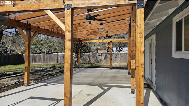 view of patio / terrace with fence, a ceiling fan, and a pergola