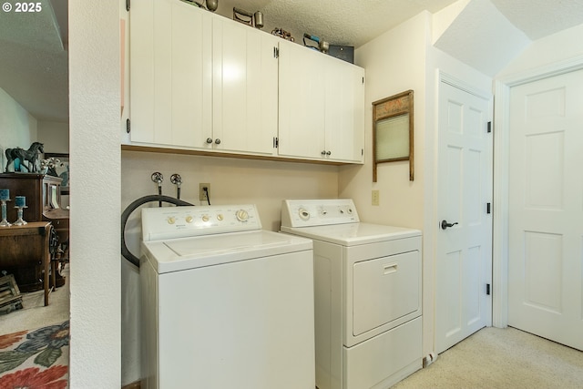 laundry room with washer and dryer and cabinet space