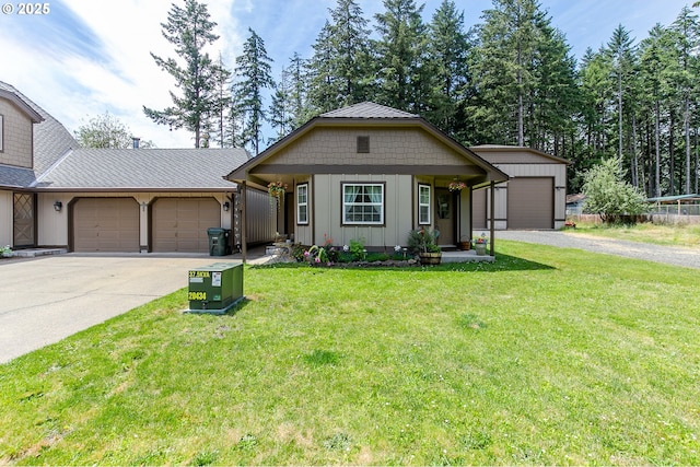 ranch-style house featuring board and batten siding, a front yard, an attached garage, and driveway