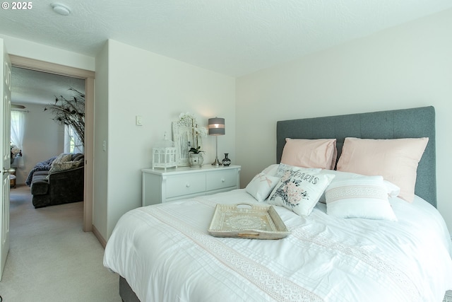 bedroom with light carpet