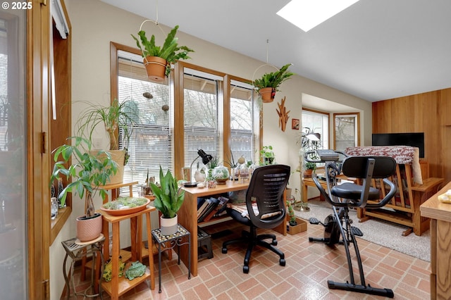 office area featuring wood walls