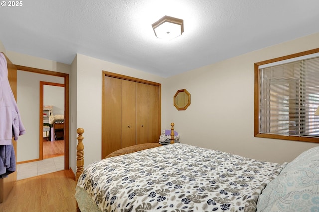 bedroom featuring a closet and light hardwood / wood-style flooring