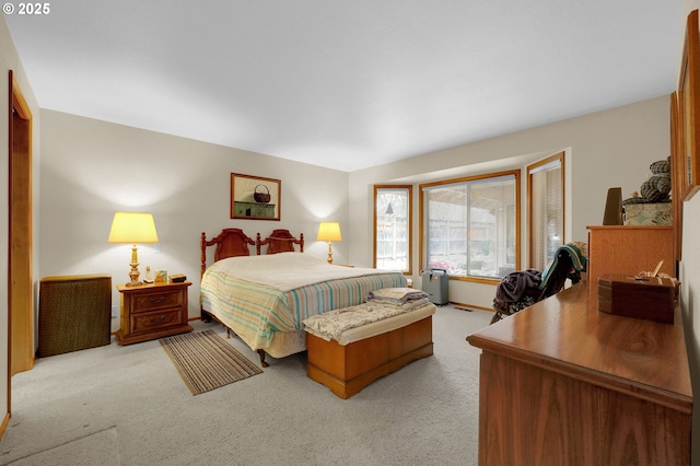 bedroom featuring light carpet