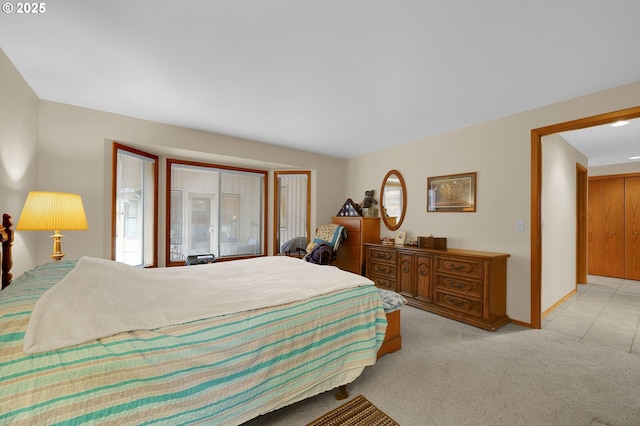 bedroom featuring light colored carpet