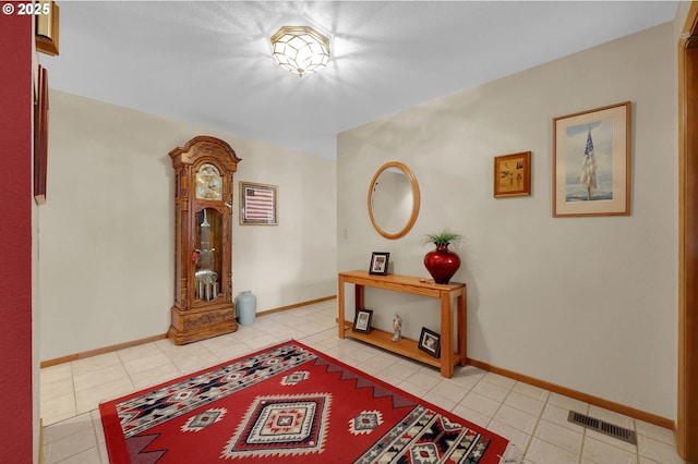 hall with light tile patterned flooring