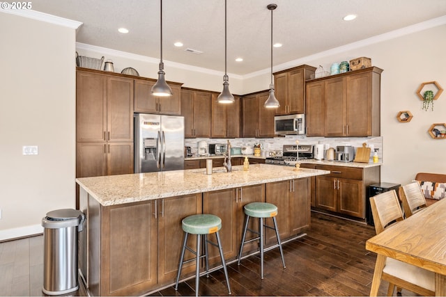13372 SW Aubergine Ter, Sherwood, OR 97140 - kitchen with appliances with stainless steel finishes, backsplash, and dark wood-style flooring