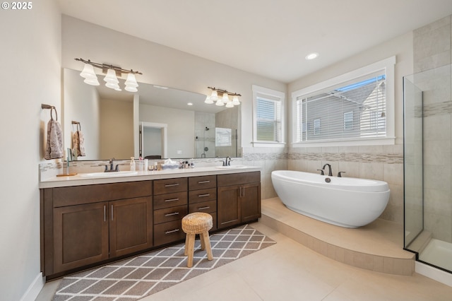 13372 SW Aubergine Ter, Sherwood, OR 97140 - full bathroom featuring a sink, a freestanding tub, a stall shower, and double vanity