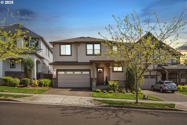 13372 SW Aubergine Ter, Sherwood, OR 97140 - view of front of house with a garage, driveway, and stone siding