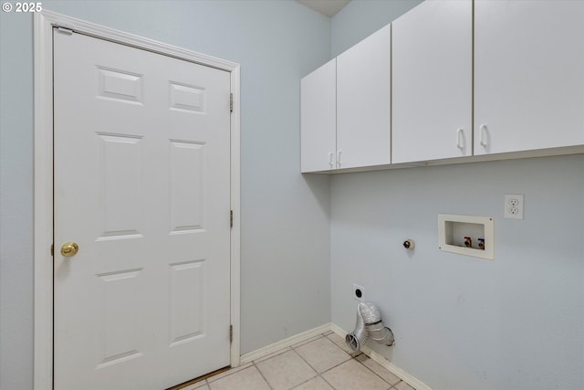 clothes washing area with light tile patterned floors, cabinets, washer hookup, hookup for a gas dryer, and hookup for an electric dryer