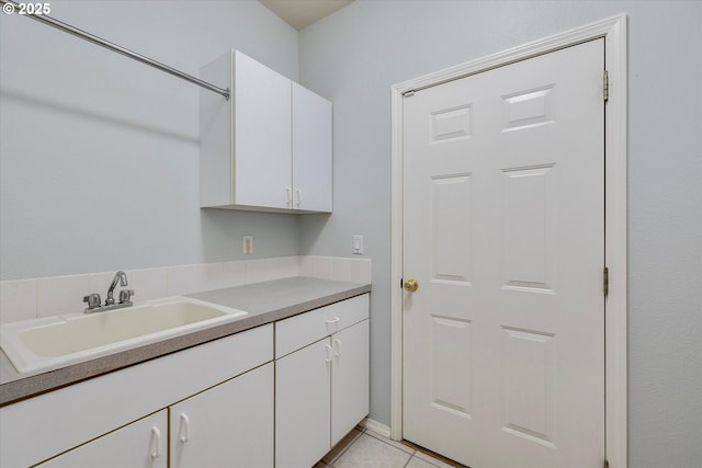 washroom with sink and light tile patterned floors