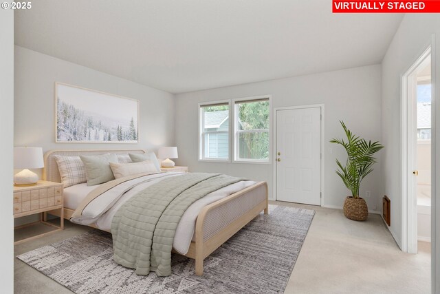 carpeted bedroom featuring multiple windows