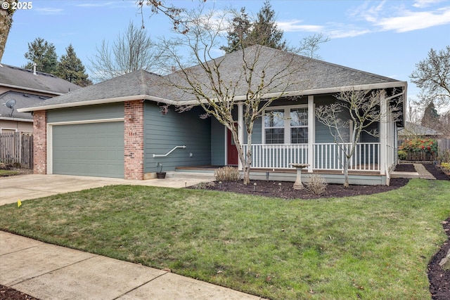 ranch-style home featuring a porch, a garage, and a front yard