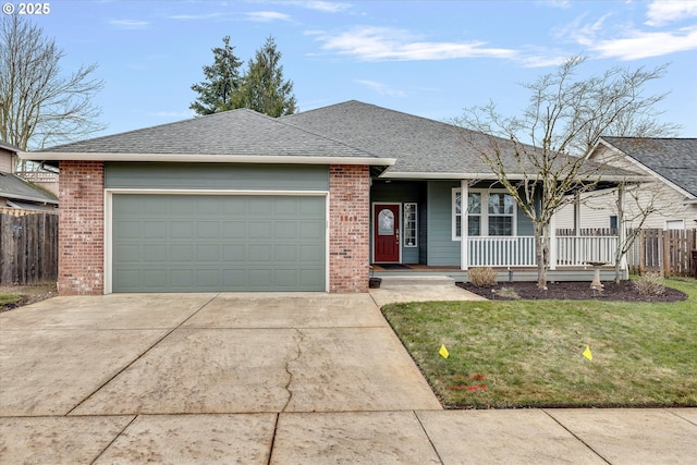 ranch-style house with a garage, a front yard, and covered porch