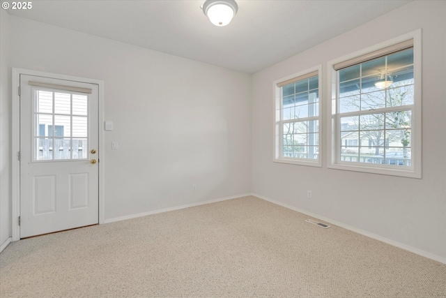 unfurnished room featuring carpet