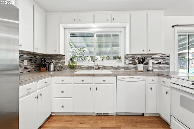 3216 Oakcrest Dr, Forest Grove, OR 97116 - kitchen featuring white appliances, decorative backsplash, light wood finished floors, and white cabinetry
