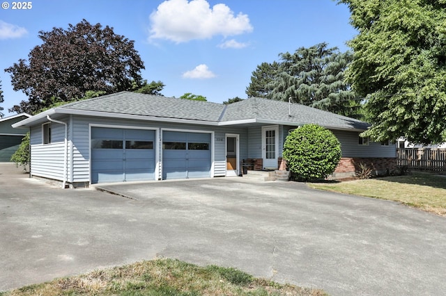 3216 Oakcrest Dr, Forest Grove, OR 97116 - ranch-style house with driveway, an attached garage, and a shingled roof