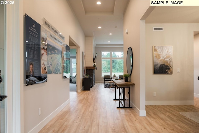 hall with light hardwood / wood-style flooring