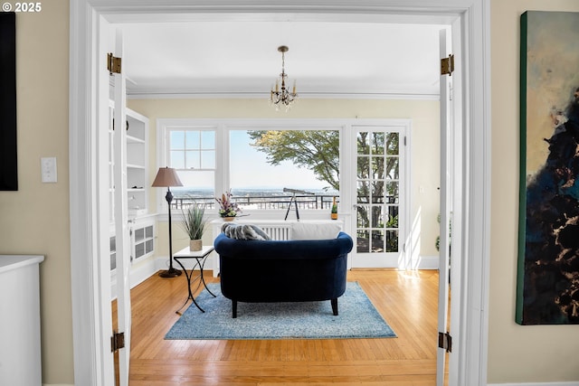 interior space with a chandelier and wood finished floors