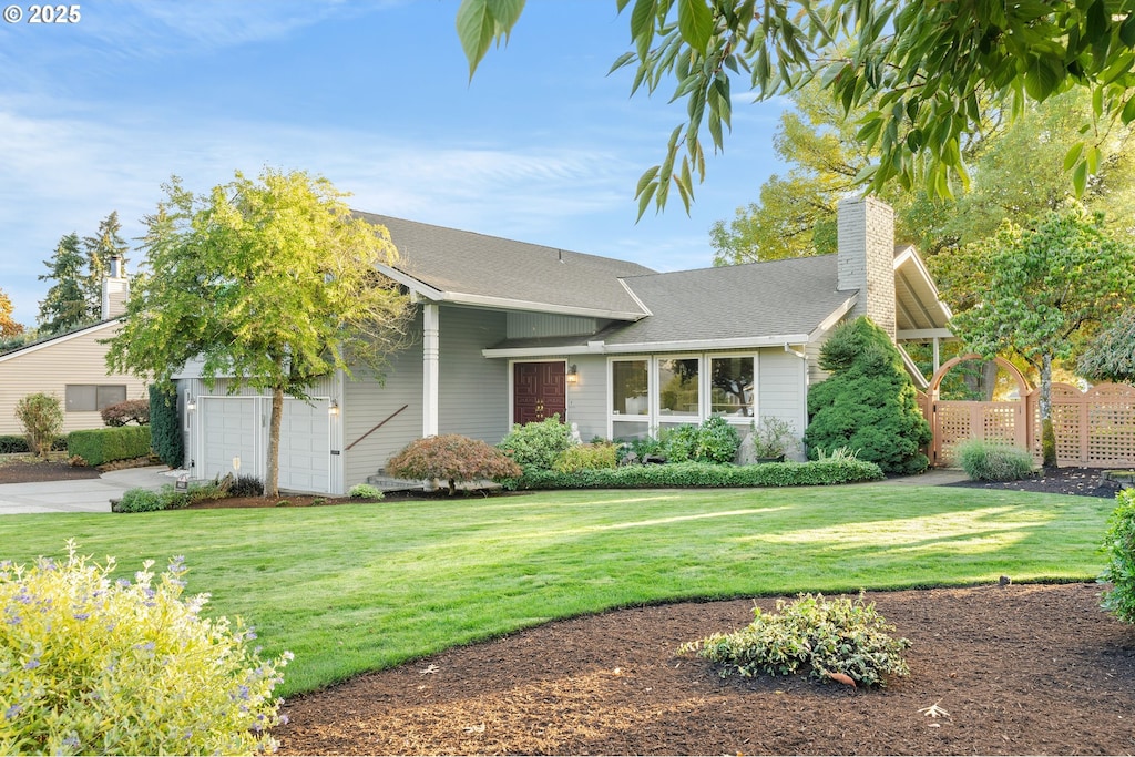 4415 NW Neskowin Ave, Portland, OR 97229 - view of front of property with a chimney, a garage, driveway, and a shingled roof