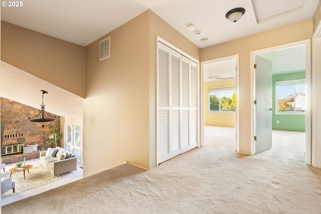 hall featuring carpet