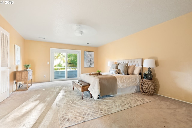 bedroom with access to outside and carpet