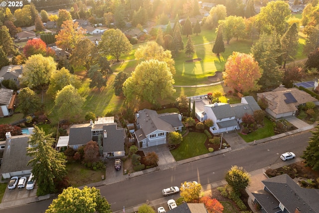 aerial view of residential area with a local golf course