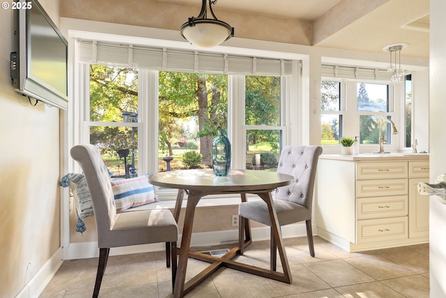 sunroom / solarium with a sink