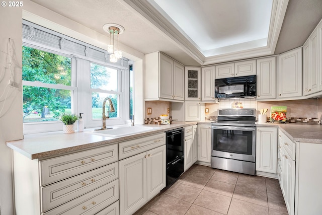 kitchen with black appliances, a sink, backsplash, light tile patterned flooring, and a raised ceiling