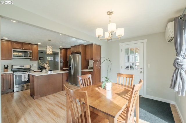 dining space with baseboards, a wall mounted air conditioner, recessed lighting, light wood-style floors, and a notable chandelier