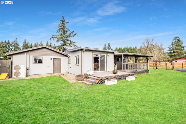 back of property featuring ac unit, a yard, and a fenced backyard