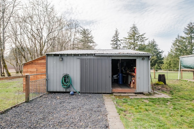 view of shed with fence