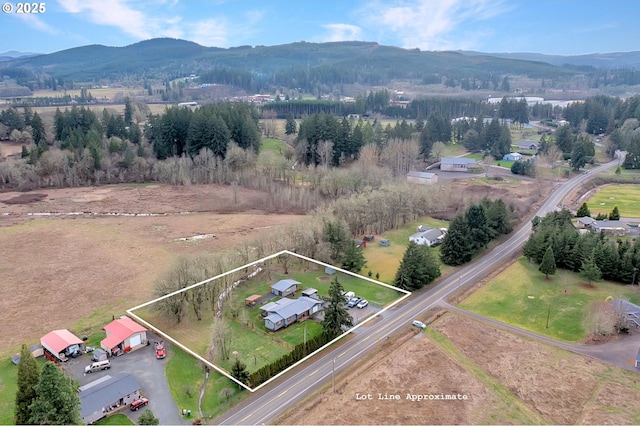 drone / aerial view with a rural view and a mountain view