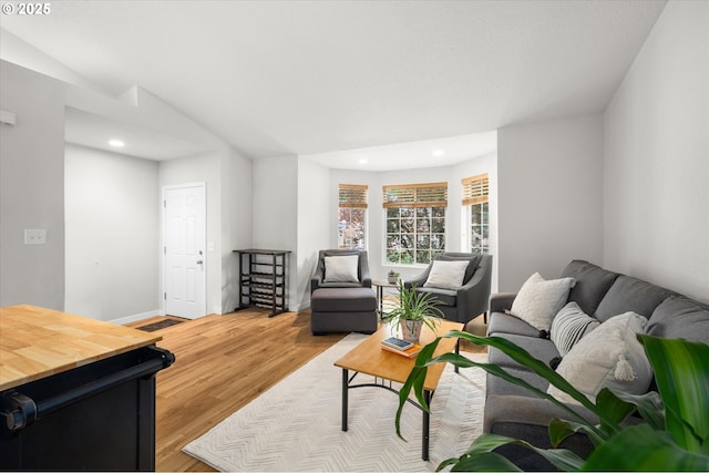 1573 SE 67th Ave, Hillsboro, OR 97123 - living room with recessed lighting, light wood finished floors, baseboards, and lofted ceiling