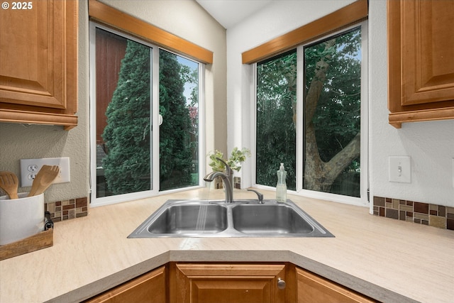 1573 SE 67th Ave, Hillsboro, OR 97123 - kitchen with a sink, light countertops, and a textured wall